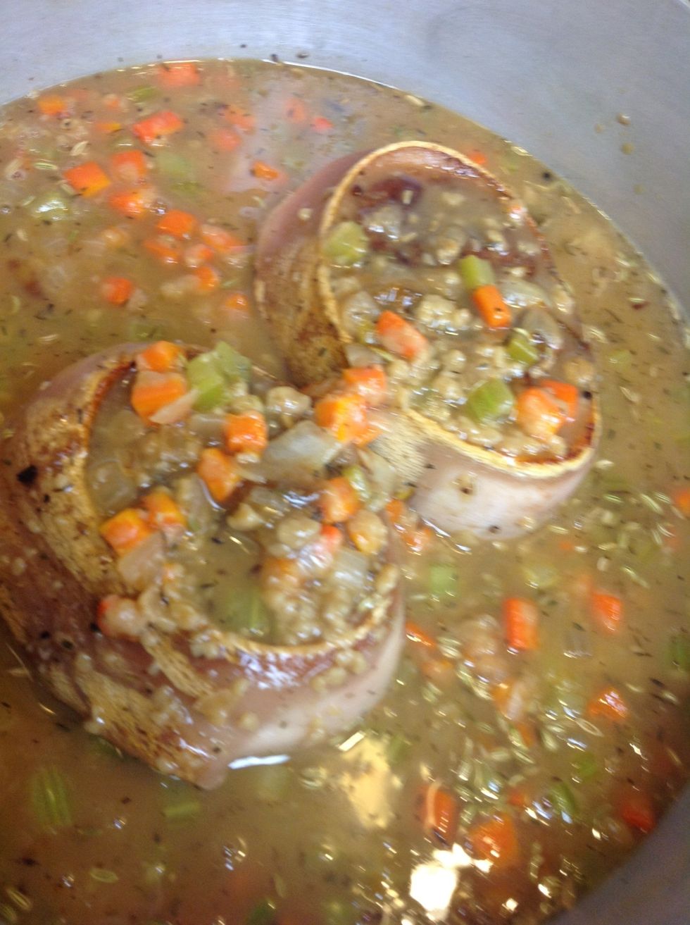 Add stock and herbs,  bring to a simmer