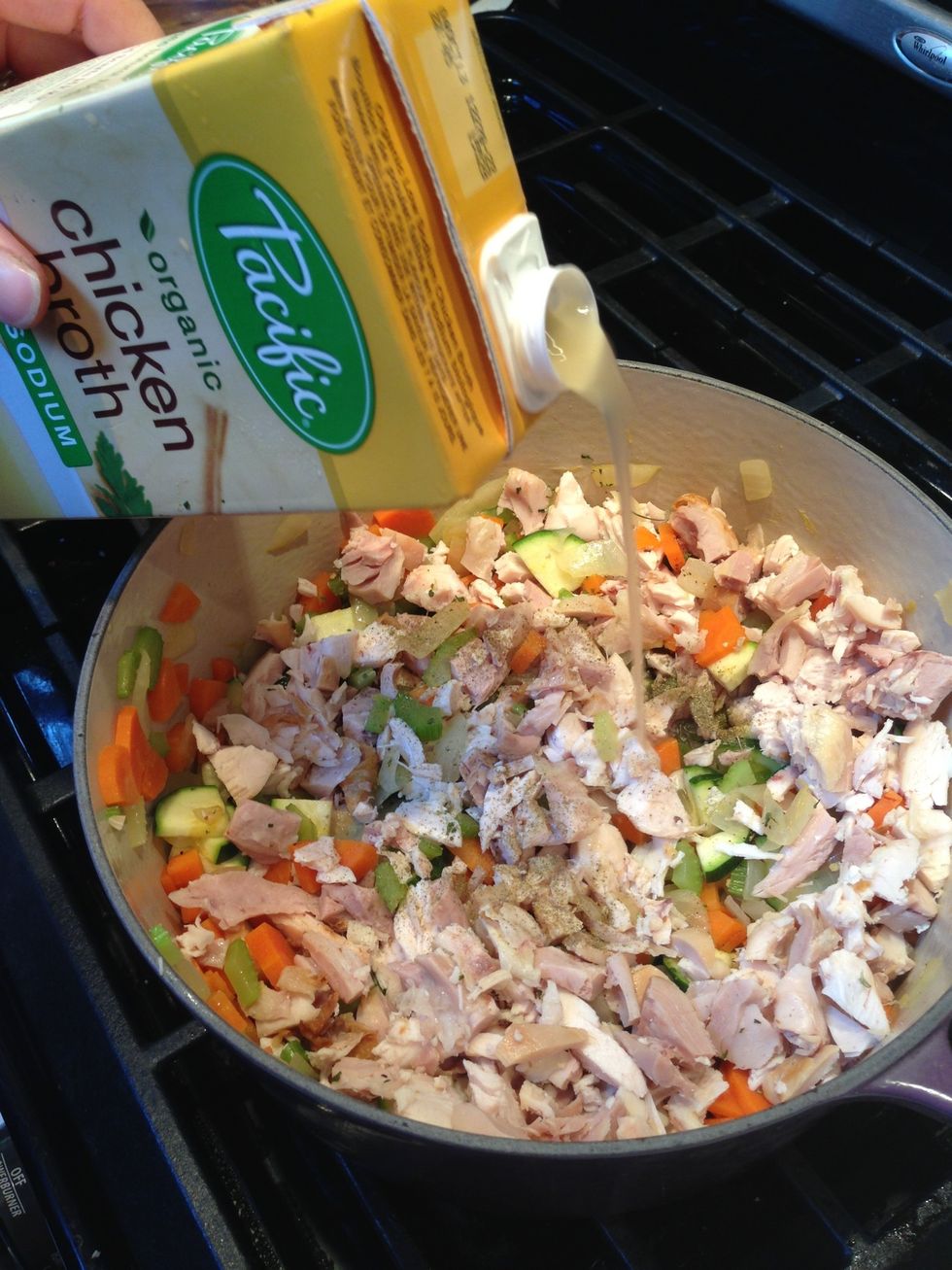 Add stock to vegetables and chopped chicken.