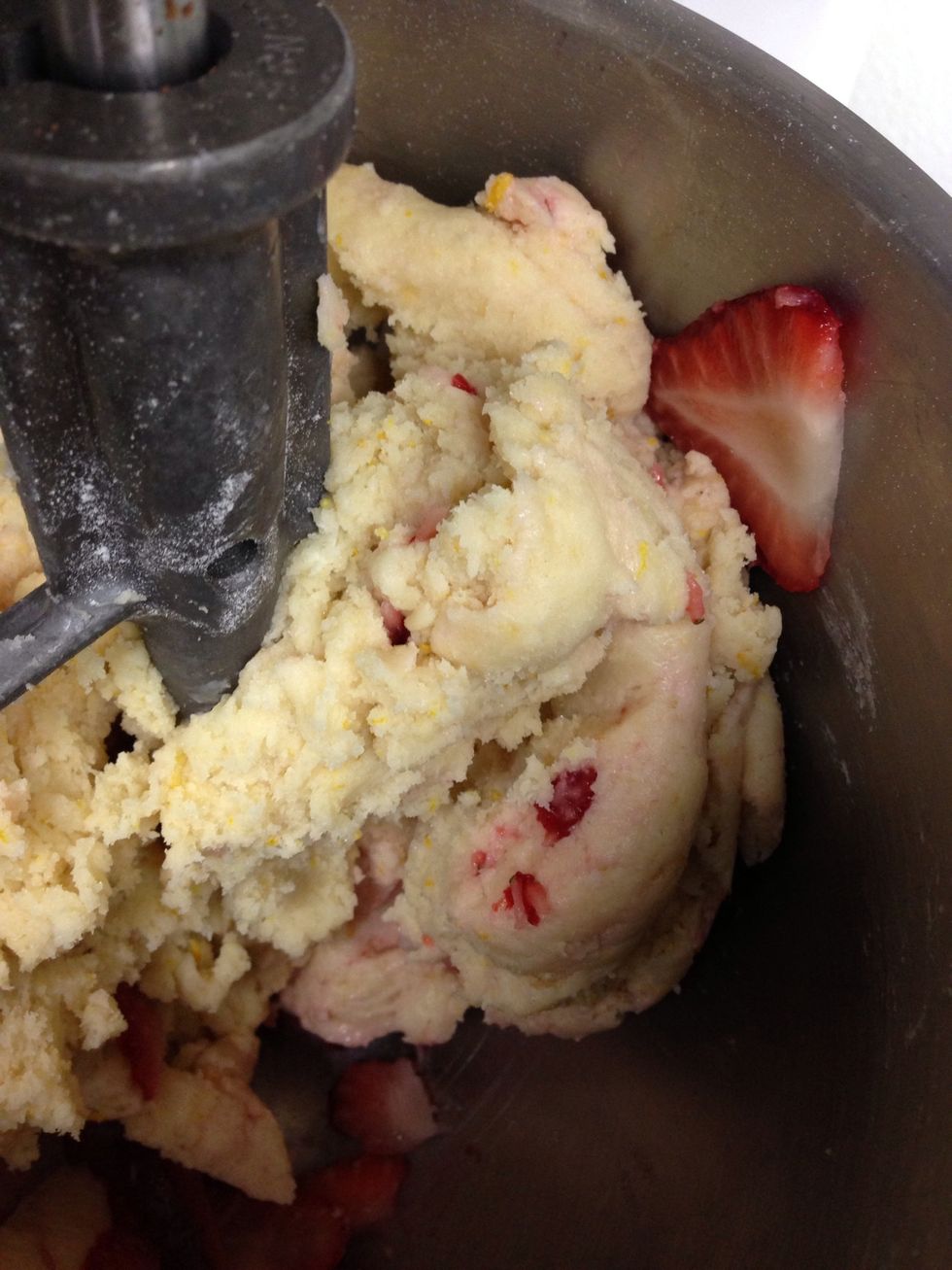 Add strawberries to the dough and mix on low until blended.