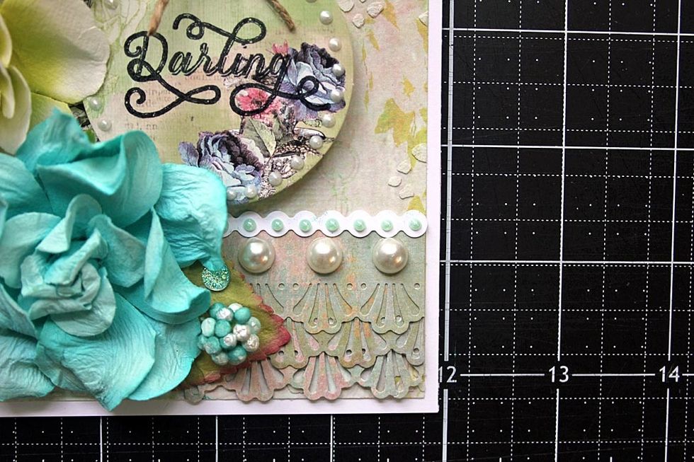 Add strip as shown, then add liquid pearls to the strip. Dry. To finish the design, scatter crystals throughout the card. ~Robin Shakoor for Prima