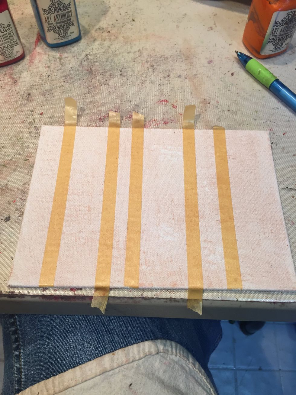Add strips of masking tape lengthwise, varying widths.