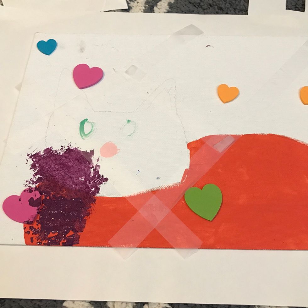 Add strips of tape around the canvas so you can paint in the gaps I had to scrape the stickers off after painting they wouldn't come off so I put some patrolmen jelly and they slid right off!