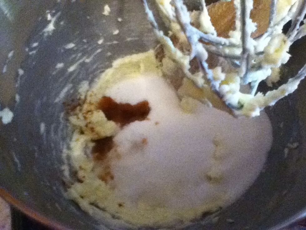 Add sugar and extracts and beat until fluffy.