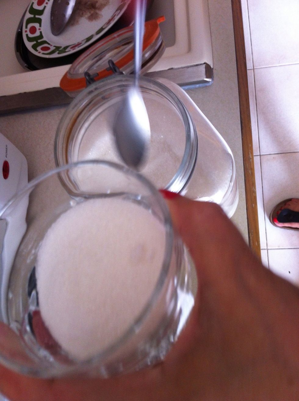 Add sugar and keep heating until the mix simmers. Keep stirring at all times to avoid sticking the mix on the pot.