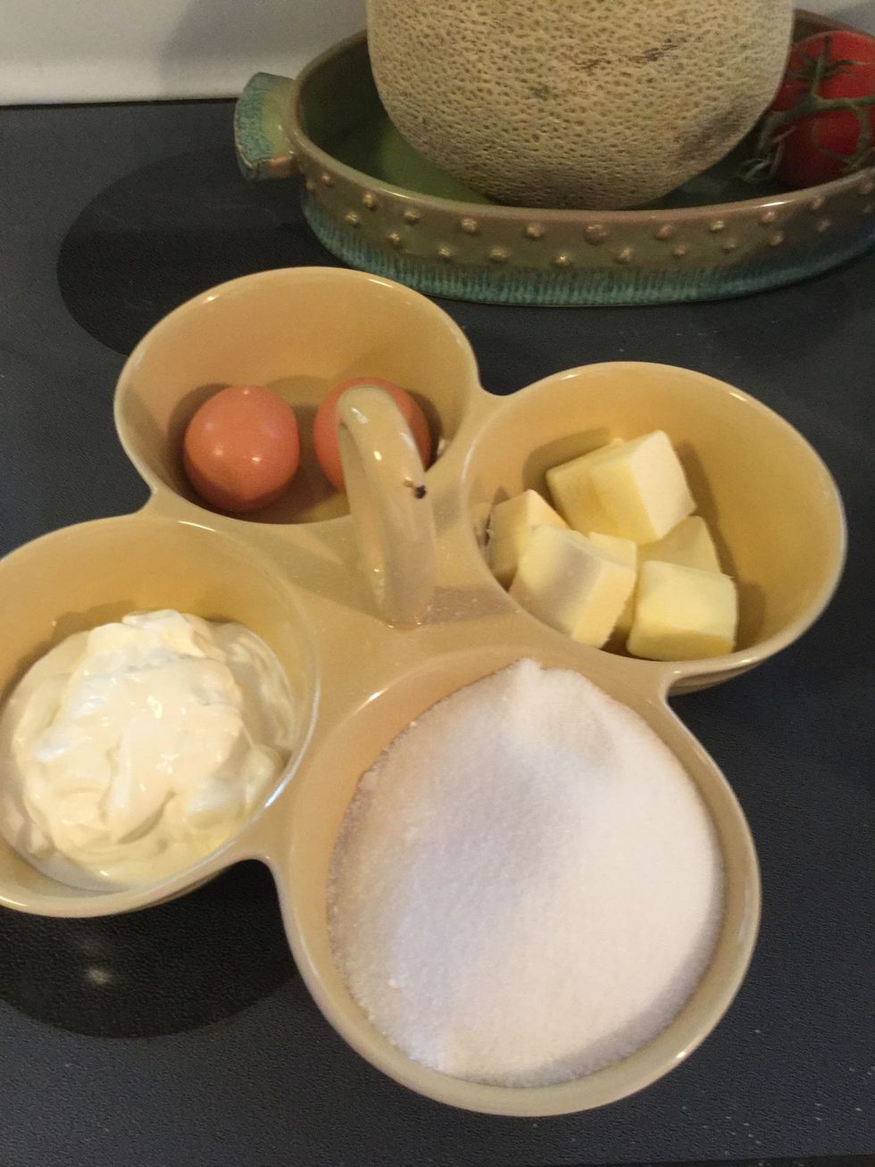 Add sugar, eggs, sour cream and butter in mixer