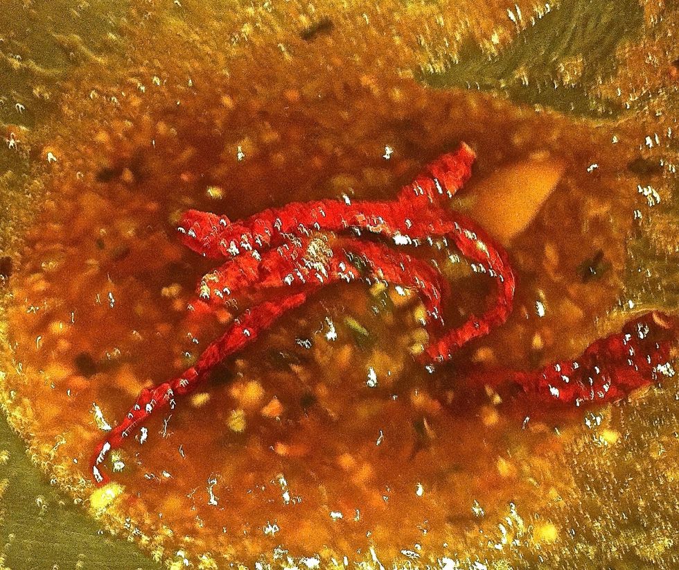 Add sugar,ginger (minced), chicken broth( or water),vinegar, soy sauce,sesame oil & peanut oil.  Bring to a boil, cook for 2 minutes. Dissolve 1 tsp cornstarch into water and stir into boiling sauce.
