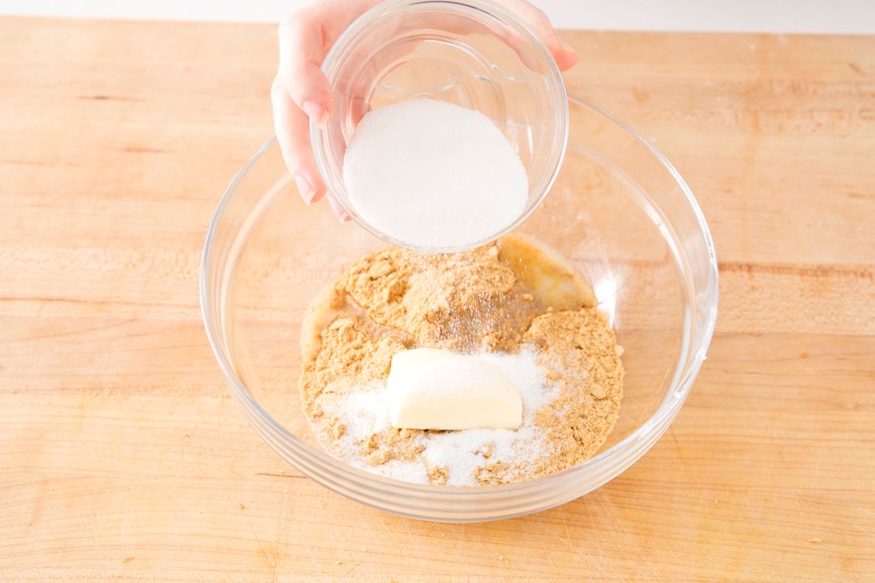 Add sugar. Mix together until all graham cracker is coated in butter.