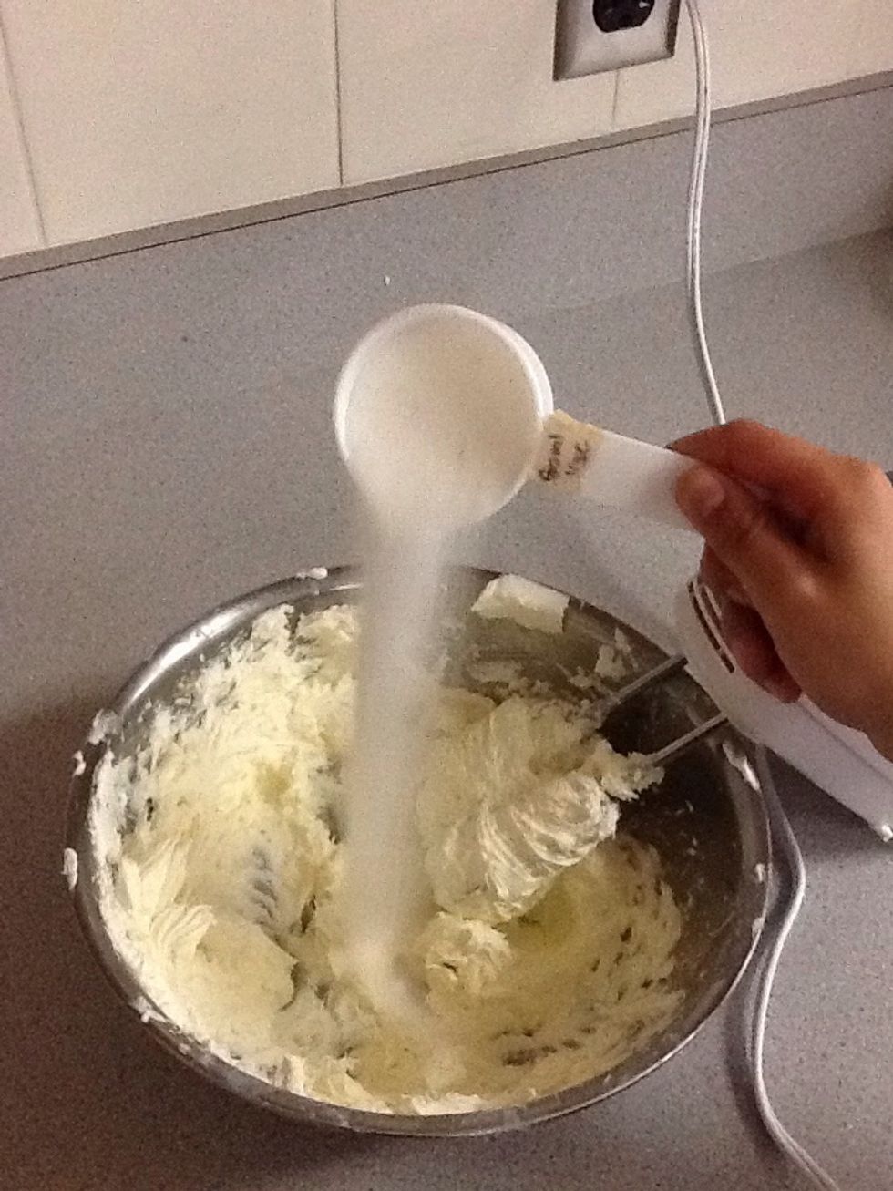 Add sugar to cream cheese
