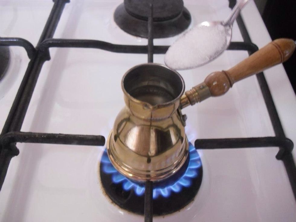 Add sugar to taste , DON'T stir it yet , let the water warm up little bit.