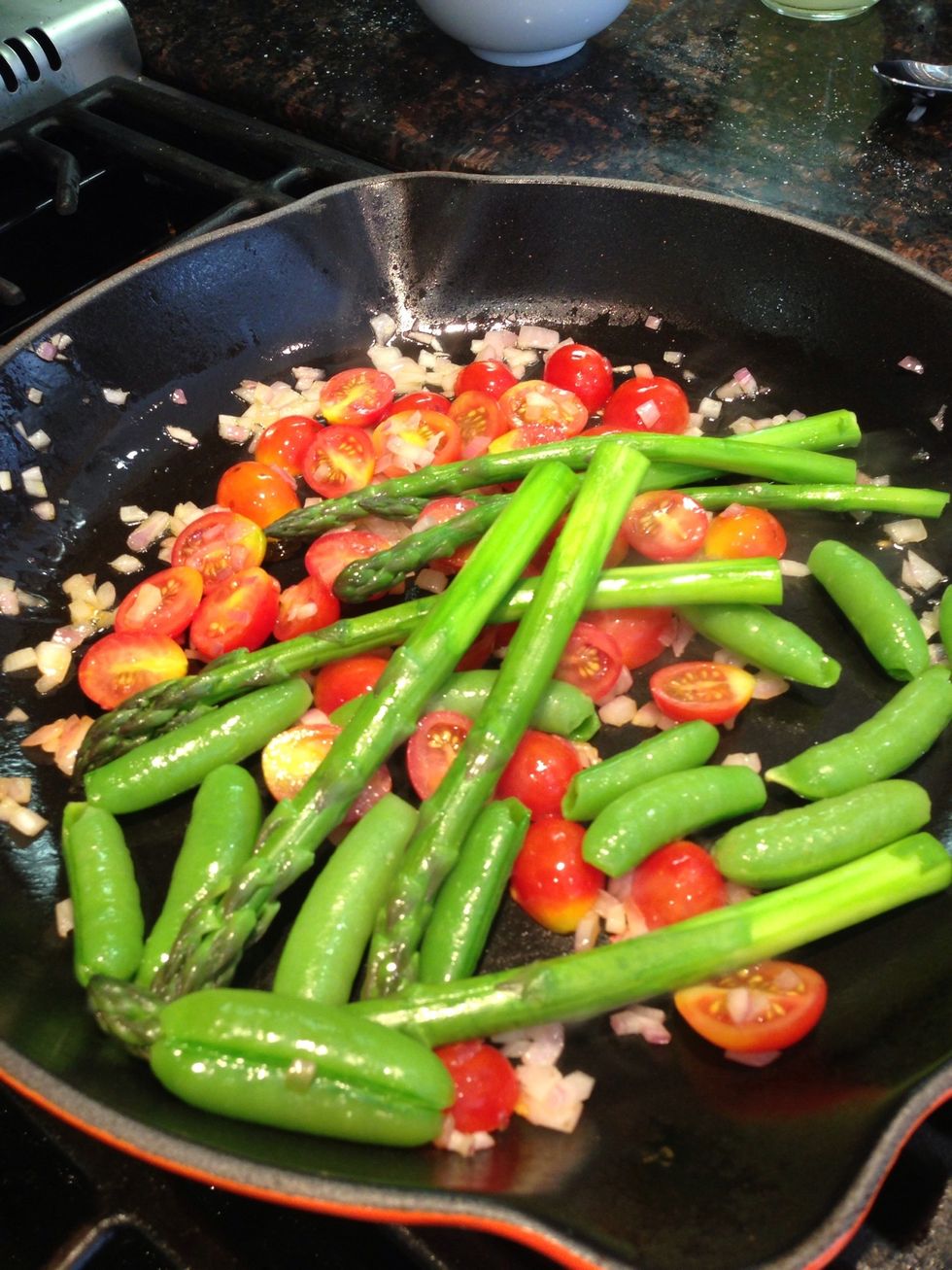 Add sweet peas, tomatoes, asparagus and saut\u00e9 for about 1 minute to warm through. Season with salt, pepper and a splash of Extra Virgin Olive Oil & Champagne Vinegar.