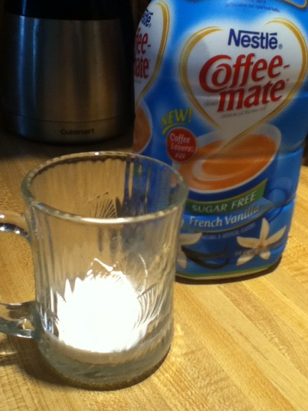 Add sweetener to your mug. I use sugar-free French vanilla creamer, but you can use sugar or honey.