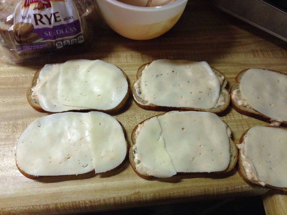 Add Swiss cheese to each slice