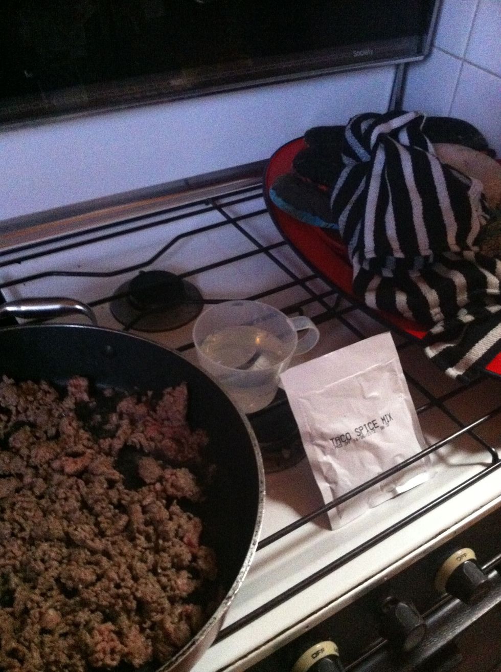 Add taco spice mix and 3/4 cup of water