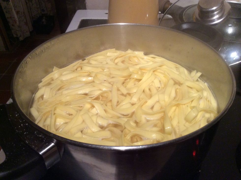 Add tagliatelle to a pan of boiling salted water. Make sure it is bubbling well. Add a dash of olive oil to prevent the pasta from sticking.