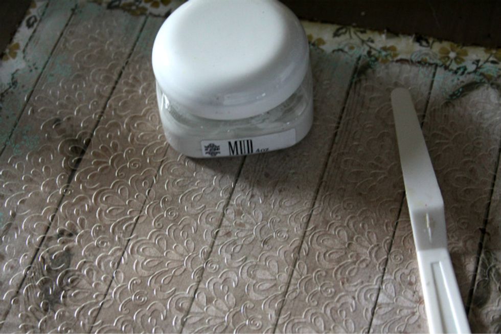 Add texture paste over stencil of your choice