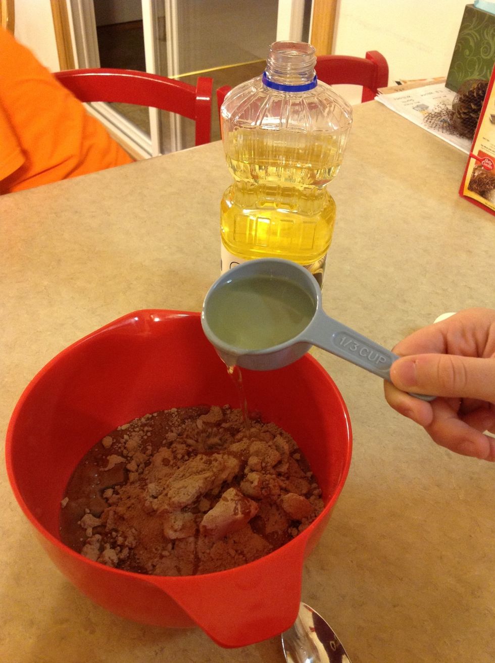 Add the 1/3 cup of vegetable oil to mixing bowl.