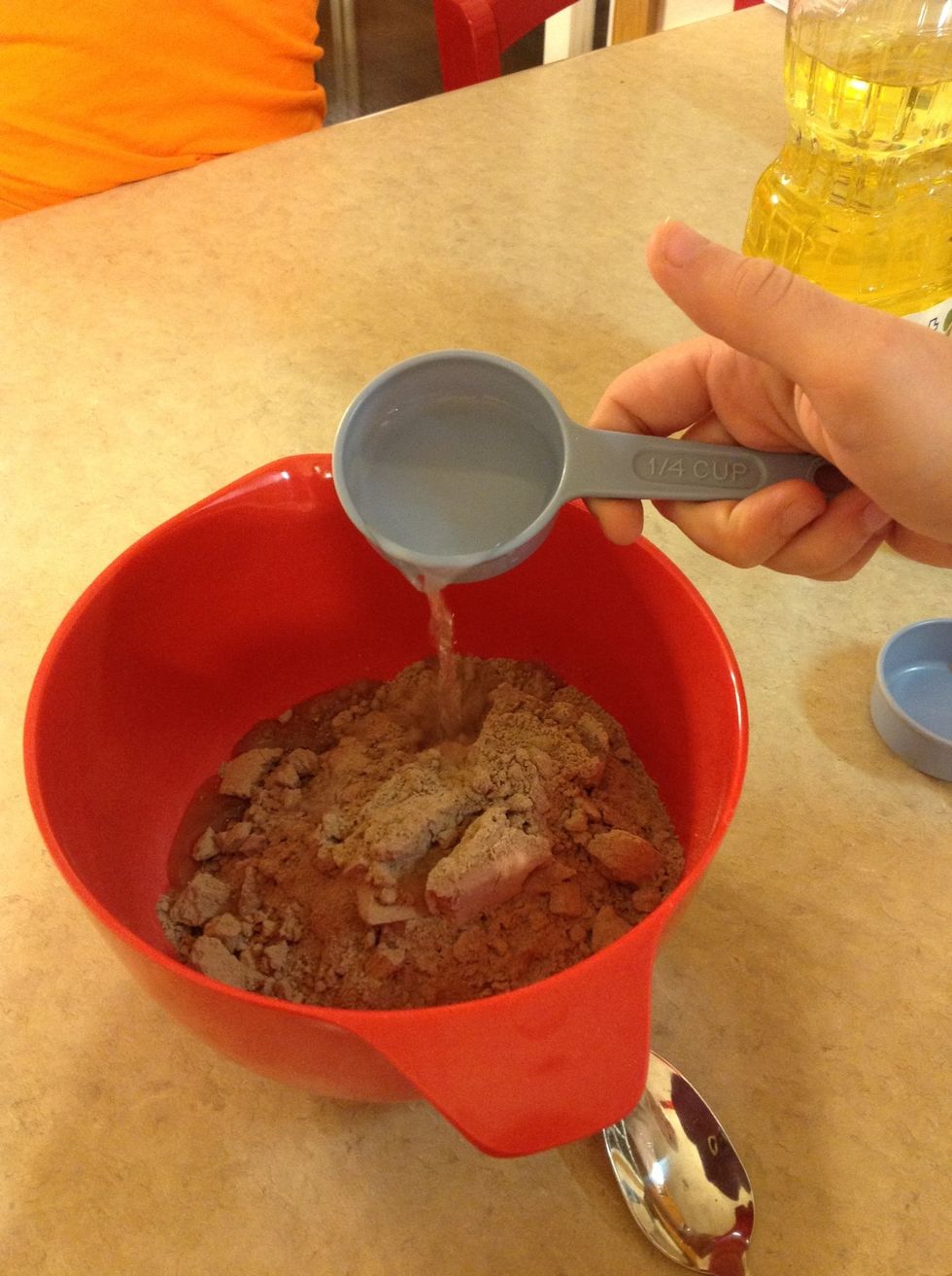 Add the 1/4 cup of water to the mixing bowl.