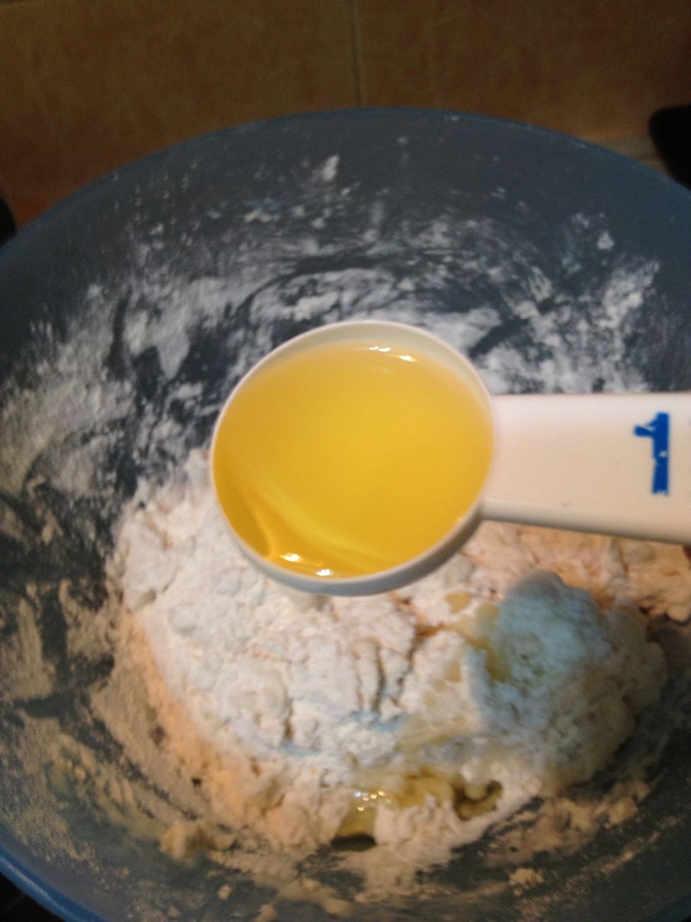Add the 1 tablespoon of oil into the flour mixture