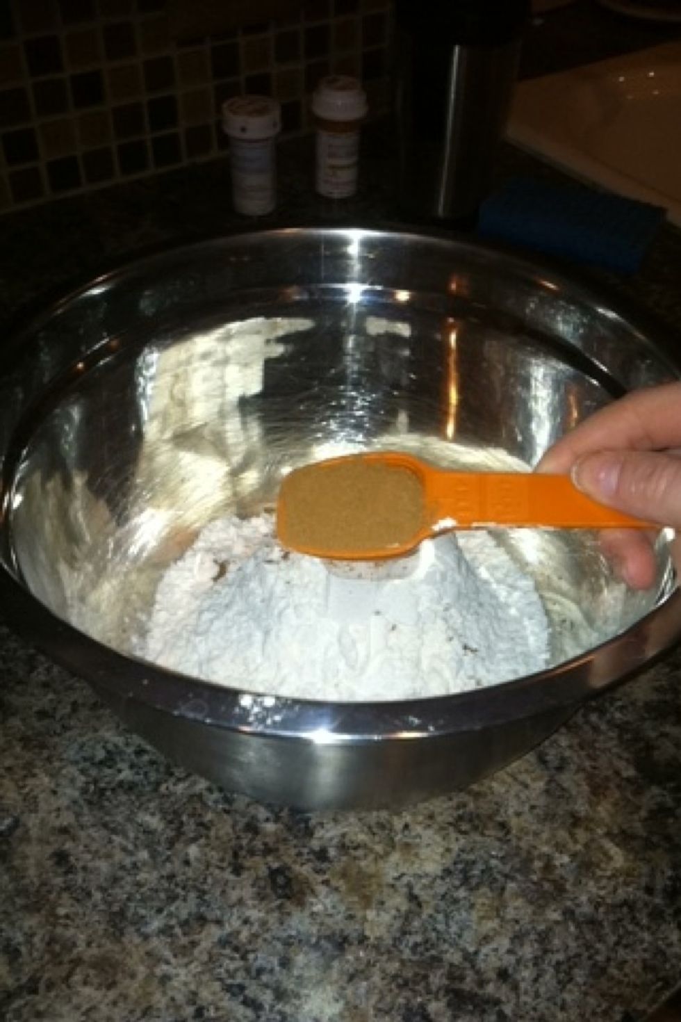 Add the 1 tablespoon of pumpkin-pie spice to the mixing bowl of flour in it