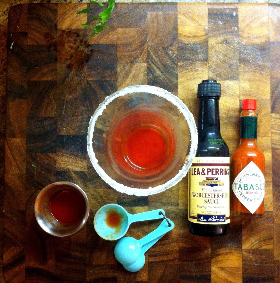 Add the 1 tbsp tomato juice, 1 dash of tobasco and 2 dashes of worcester sauce.