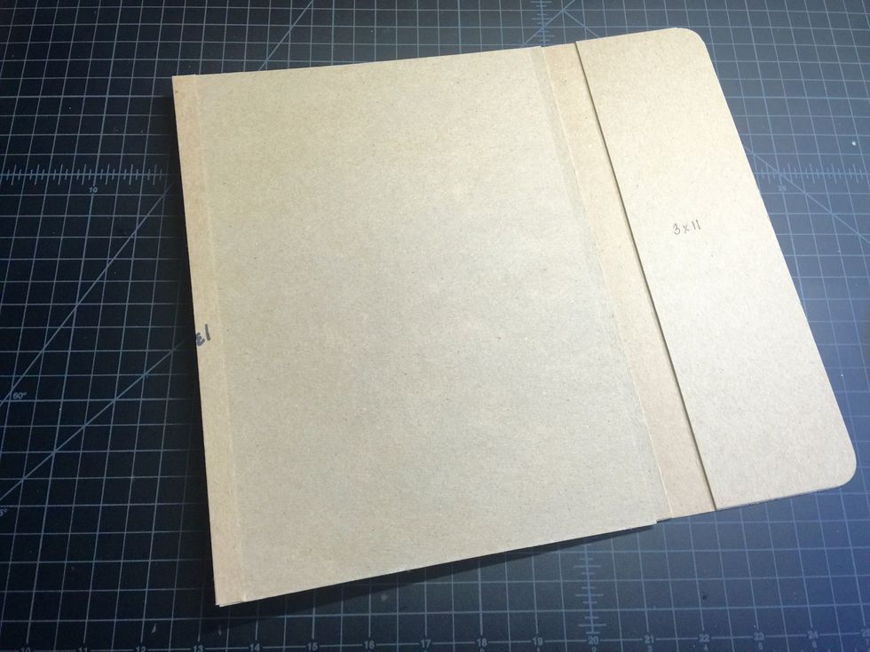 Add the 2"x11" chipboard to the opposite side of the 8"x11" chipboard using the last hinge.