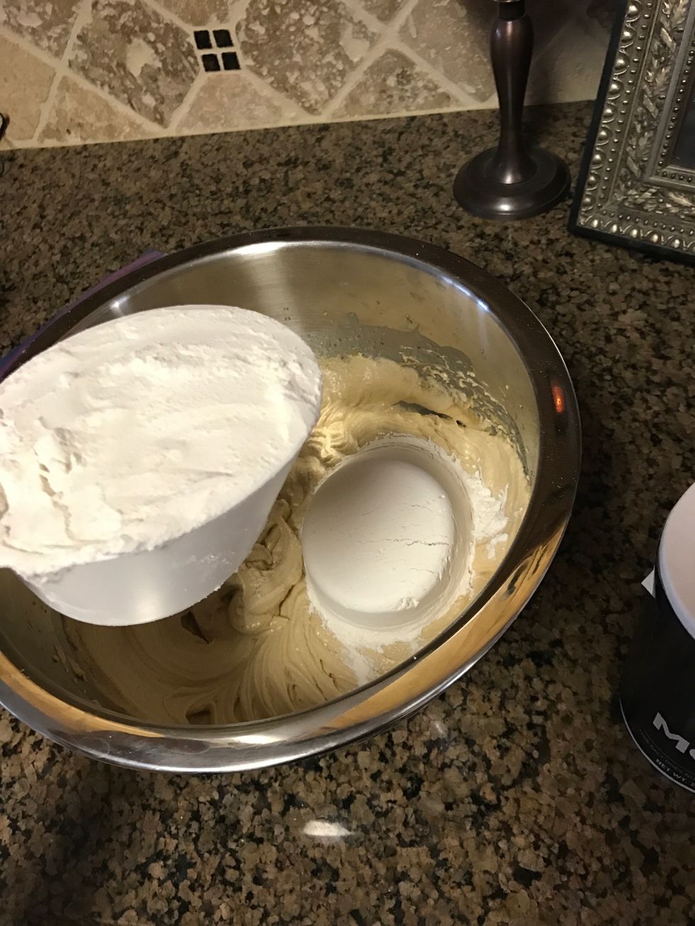 Add the 3 cups of flour to the mixture. Mix together until it forms a thick, doughy consistency