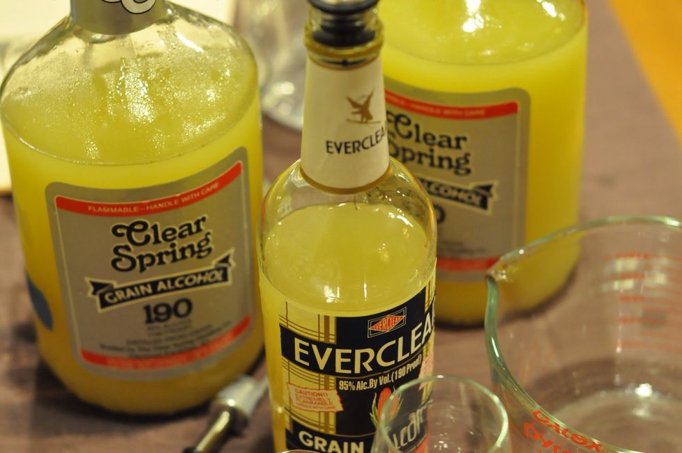 Add the alcohol to the lemon peel jar. Note :ever clear is clear, the picture showing here already have previous batch in it.