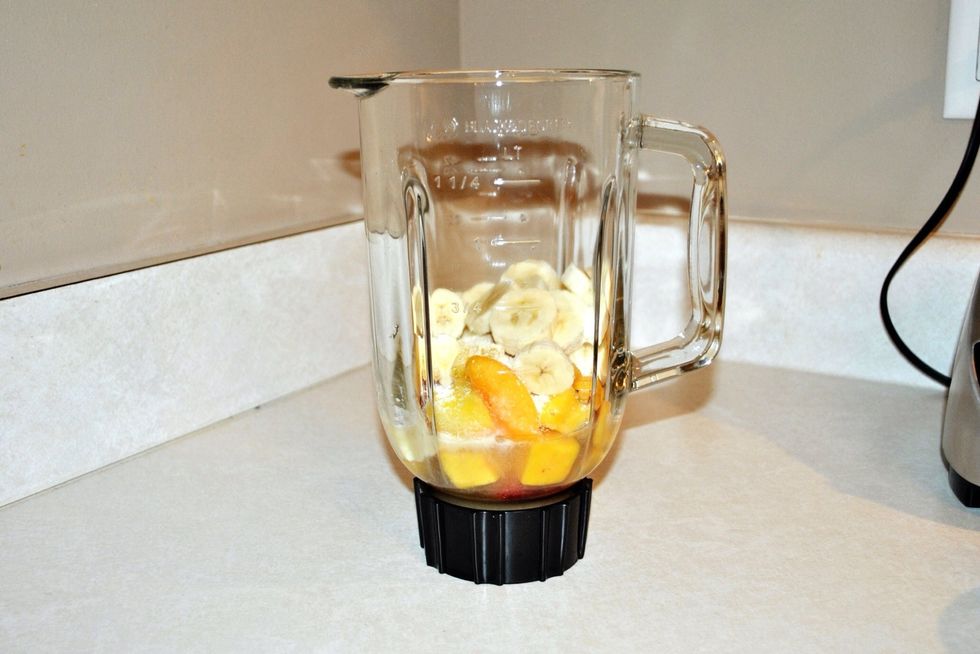 Add the apple juice first, followed by the frozen fruit, then the protein powder, and then by the banana.