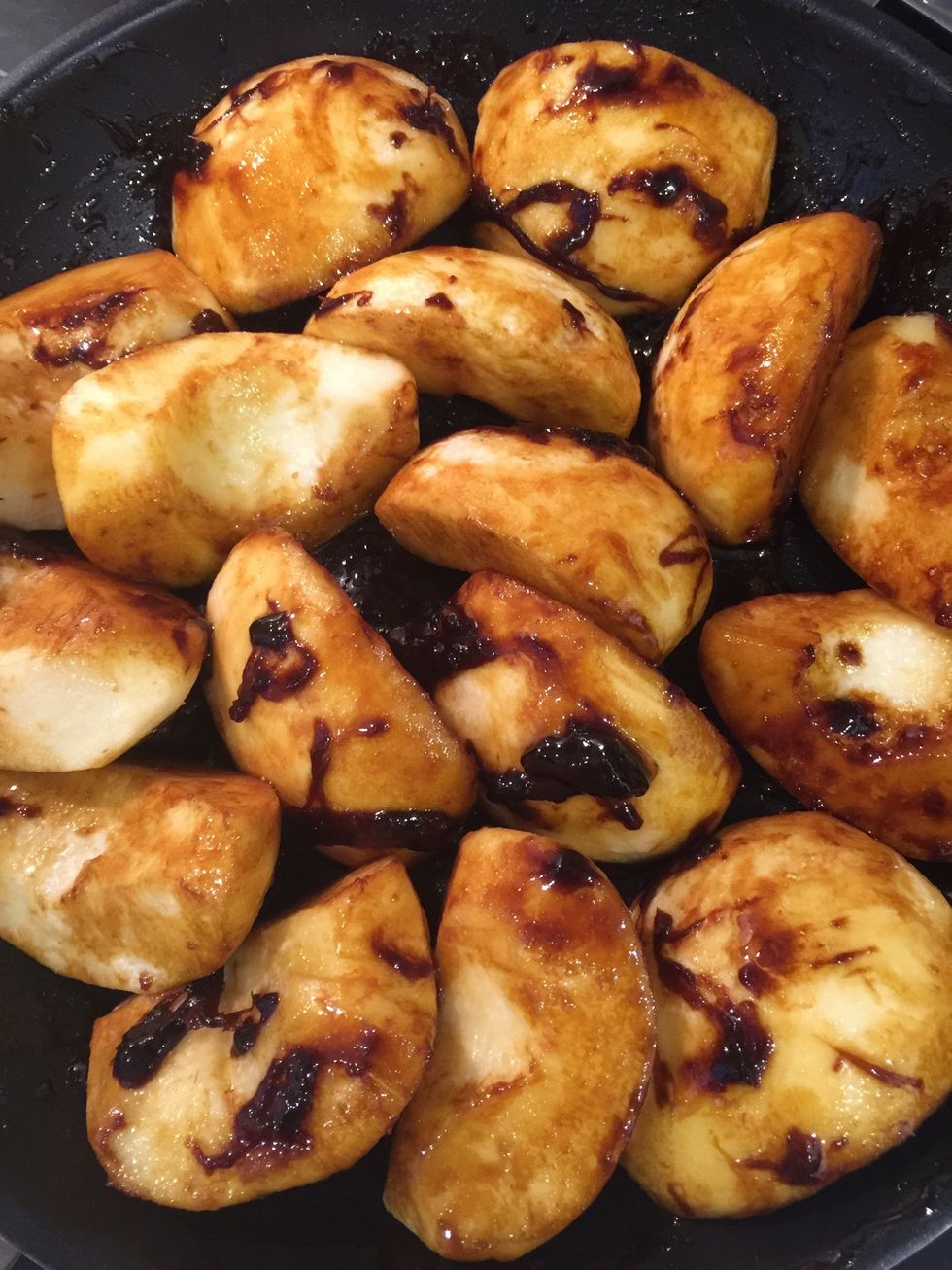 Add the apples. And coat them with caramel as much as possible. You will get some caramel lumps .. Don't worry they will melt and mix with the apple juice to make a wonderful caramel