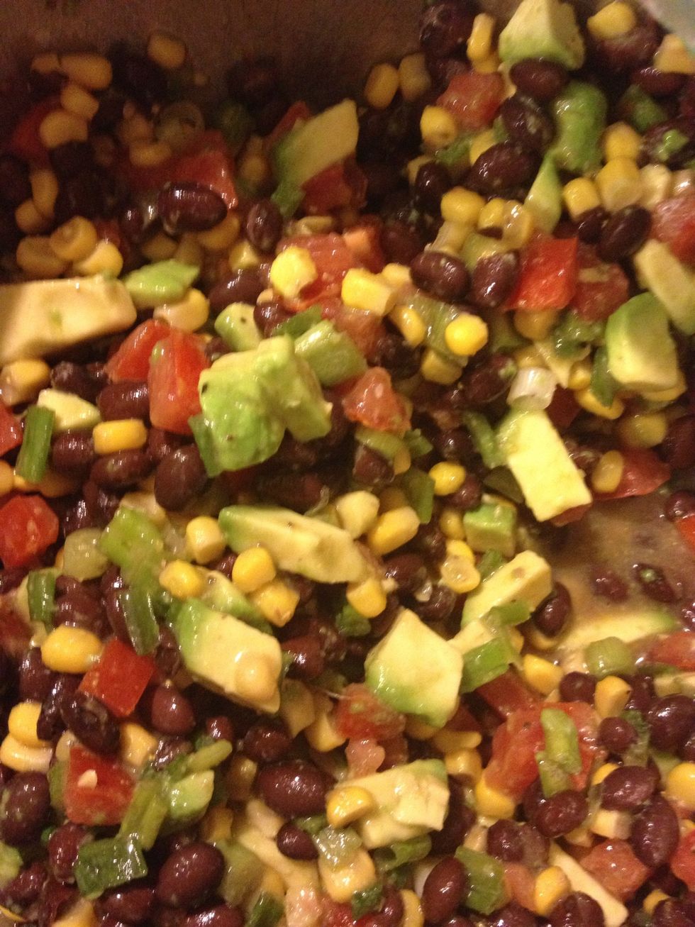 Add the avocado to the bowl, mix and serve with corn chips. Enjoy.