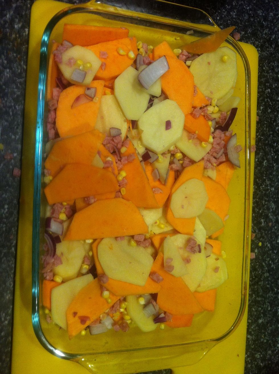 Add the bacon, corn and crushed garlic and mix a little to evenly disperse the ingredients.