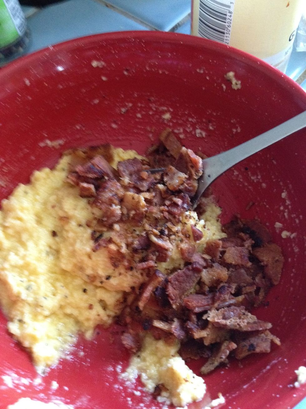 Add the bacon to the cheese-egg mixture and stir.