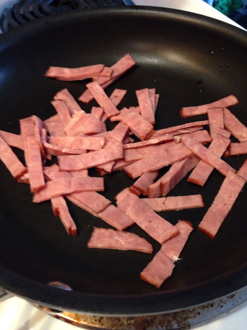 Add the bacon to the pan and cook until nice and brown.