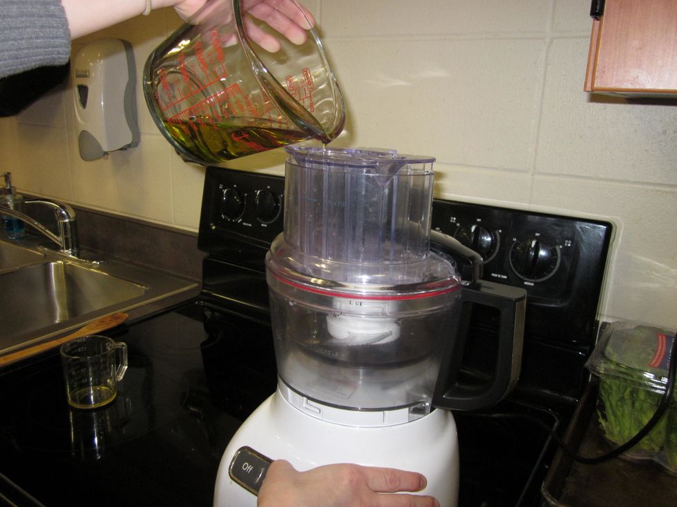 Add the balsamic vinegar to the bowl of the mixer and turn on low speed. Slowly add in the oil while it's mixing together