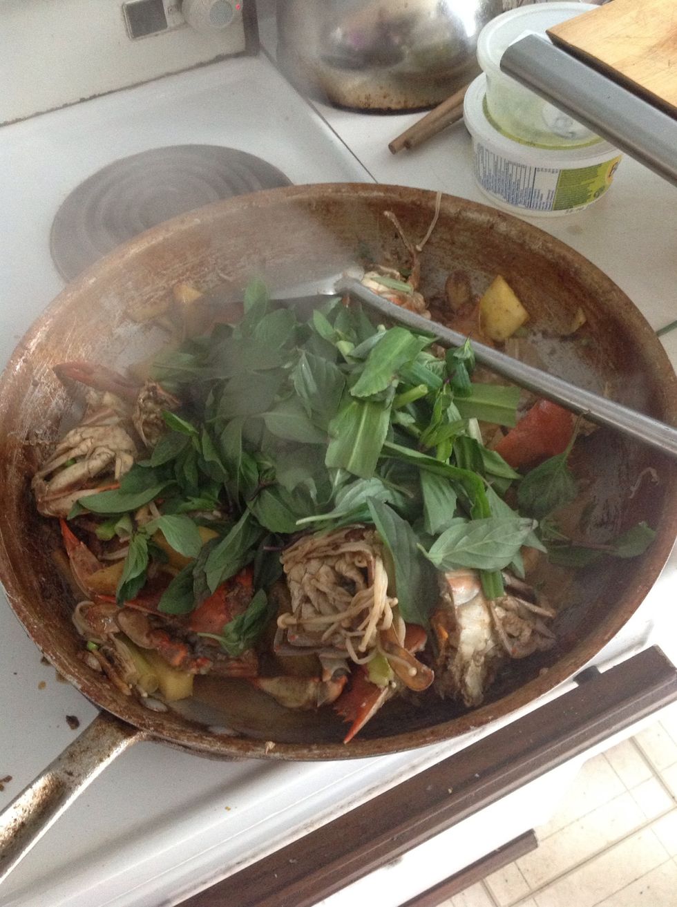 Add the basil and the saw leaves and green onion.