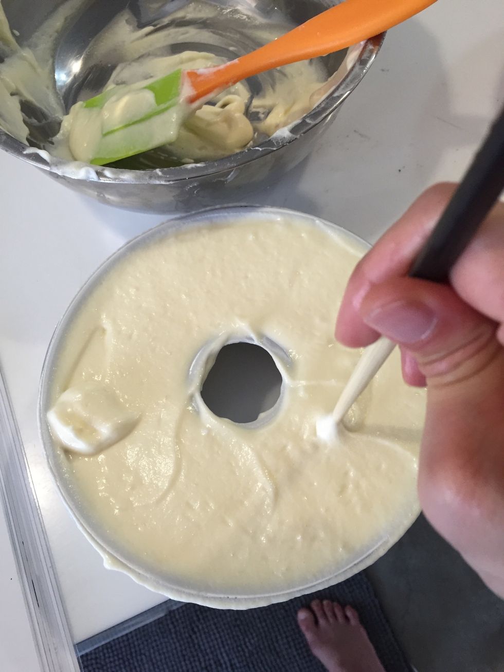 Add the batter to the mold. Today i use 16 cm chiffon mold. And a coffee mug. With a chopstick draw circular motion in the batter to get rid of any air pocket trapped in the batter.