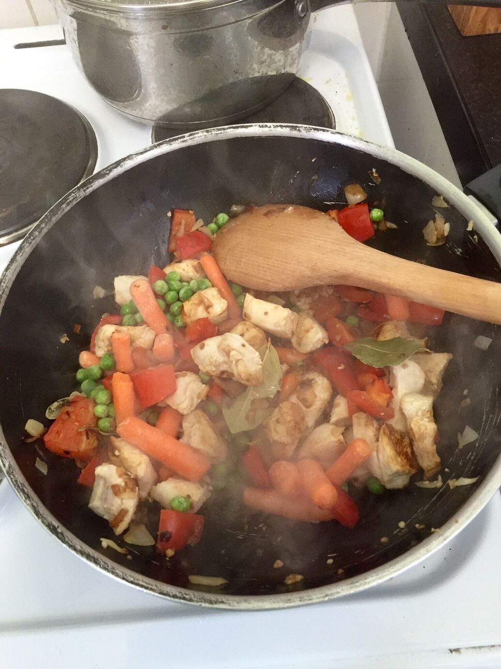 Add the bay leaves and the frozen vegs (this stew is a great way to get my family to eat vegs)