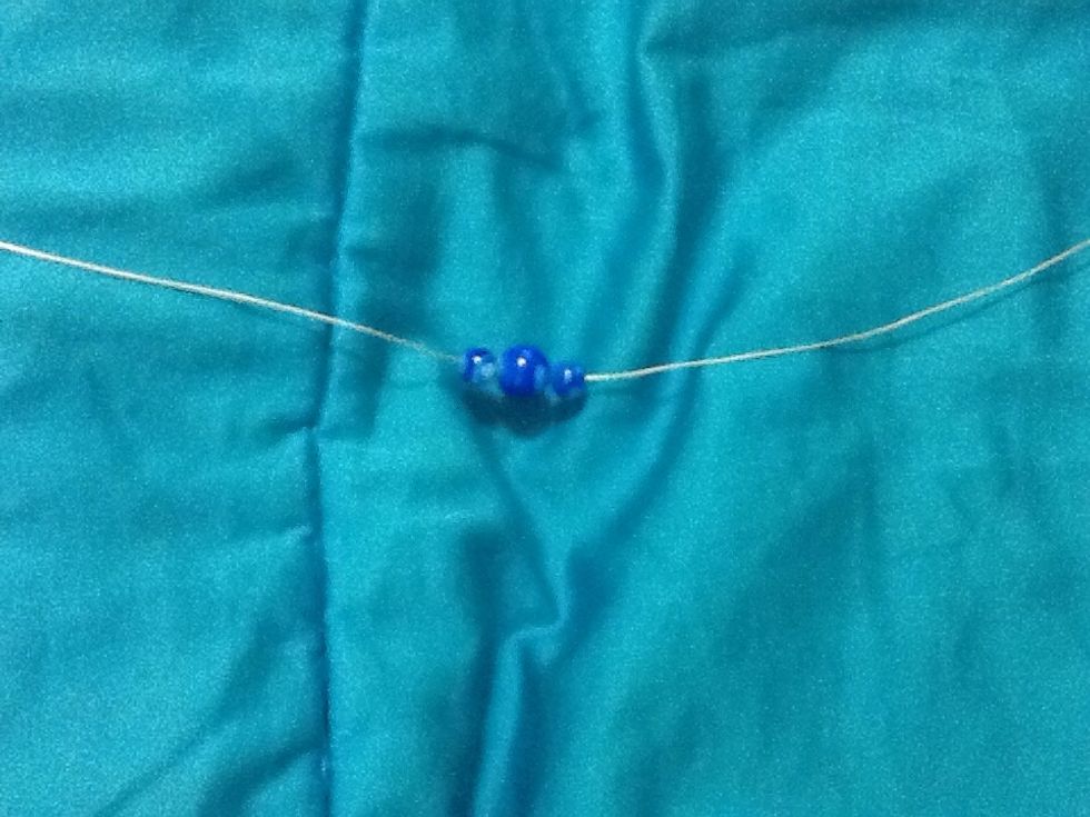 Add the beads to the center of your wire