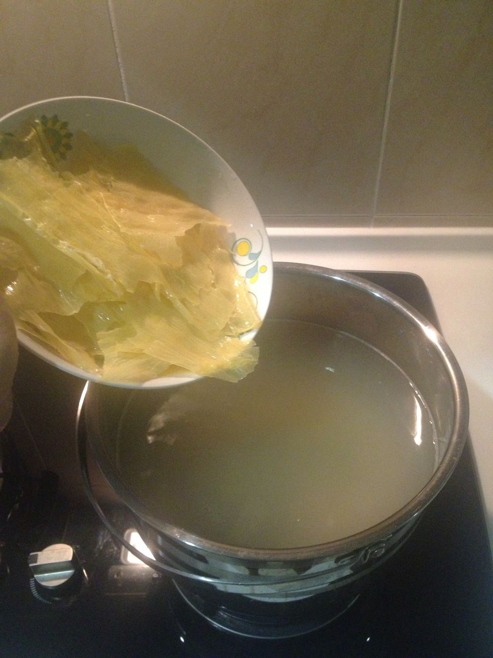 Add the bean curd sheet into the pot.