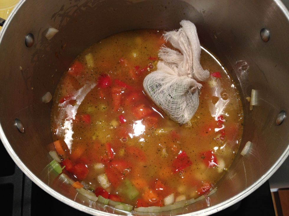 Add the beans, enough vegetable stock to cover, and the bouquet  garni. Bring to a boil. Cover the pot, then reduce the heat to a simmer. Let simmer for about 35 minutes.