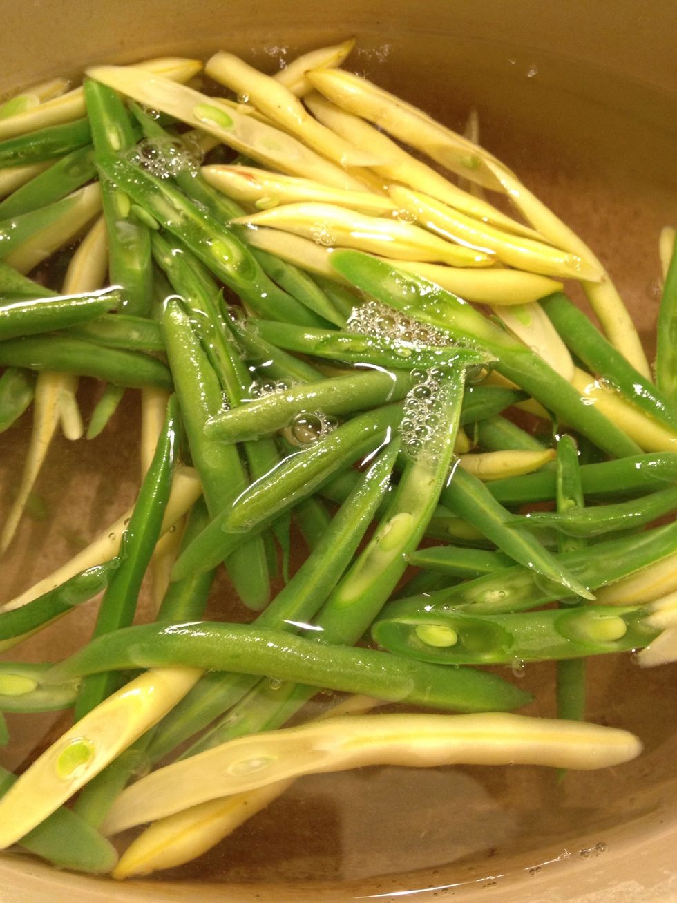 Add the beans. Make sure the fire is always on high. Don't worry about color mixing.