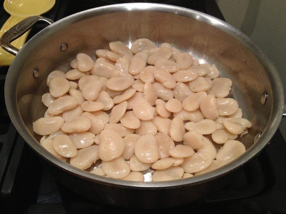 Add the beans to hot skillet, and stir until they are coated in the olive oil. This dish works best if you can have the beans in a single layer. That way they can get really golden and crusty.