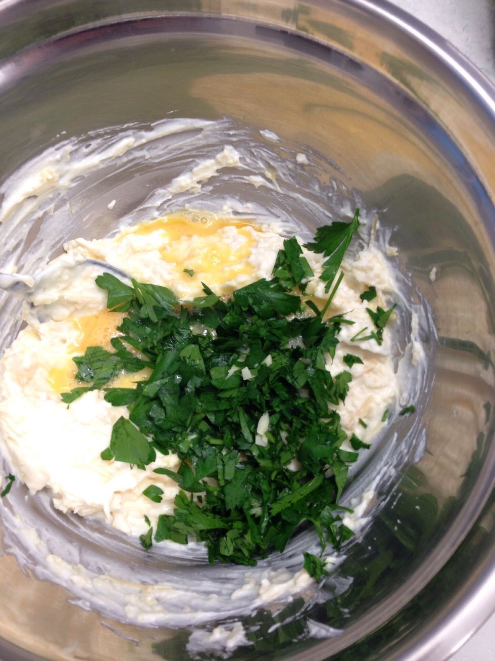 Add the beaten egg and chopped parsley