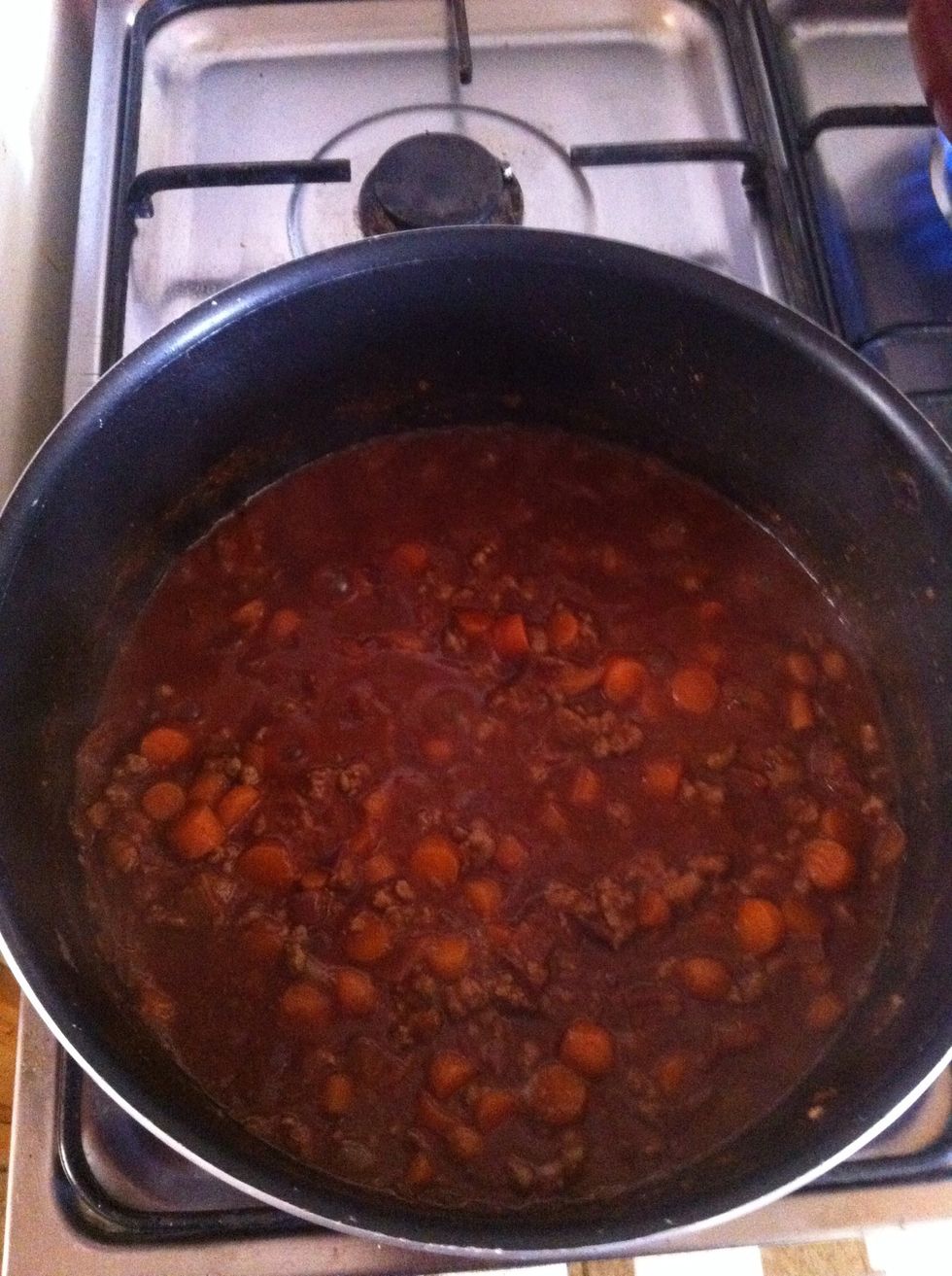 Add the beef, make sure it's browned, then add tomatoes, tomato paste, stock and the herbs. Add salt and pepper to taste
