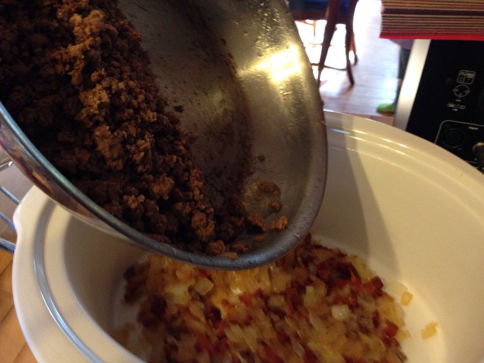 Add the beef to the crock pot.