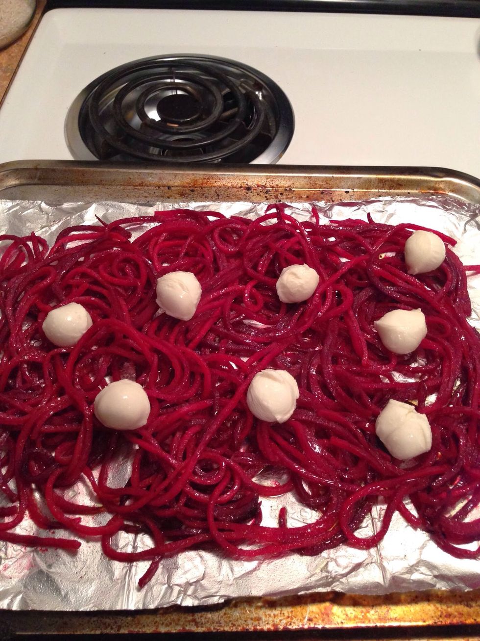 Add the beet noodles to the oven and cook for about 2-3 minutes. Remove from the oven & place the mozzarella on top of the noodles.