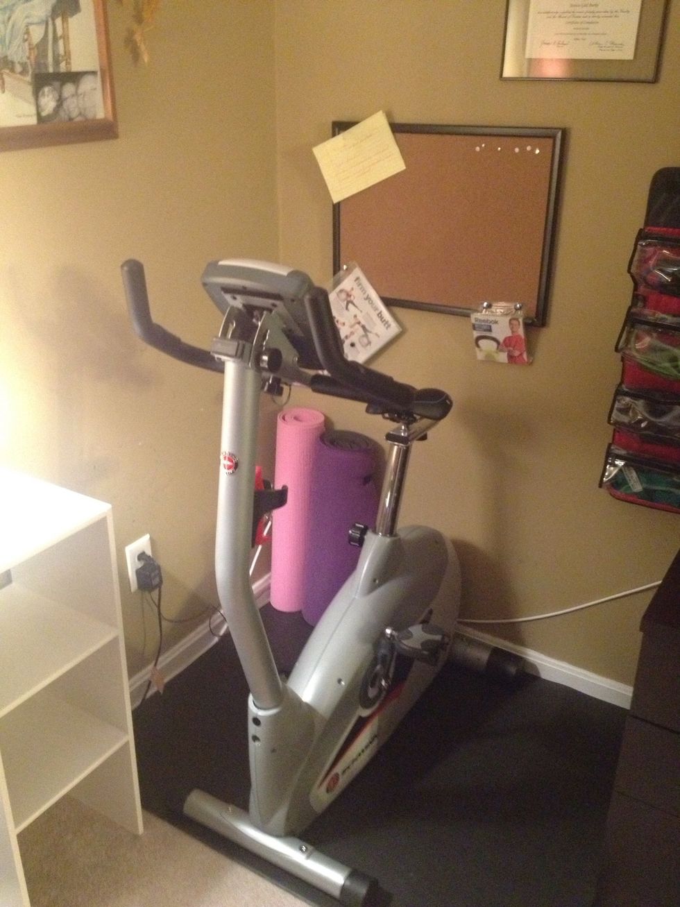 Add the bike and in the back you can see my yoga mats against the wall