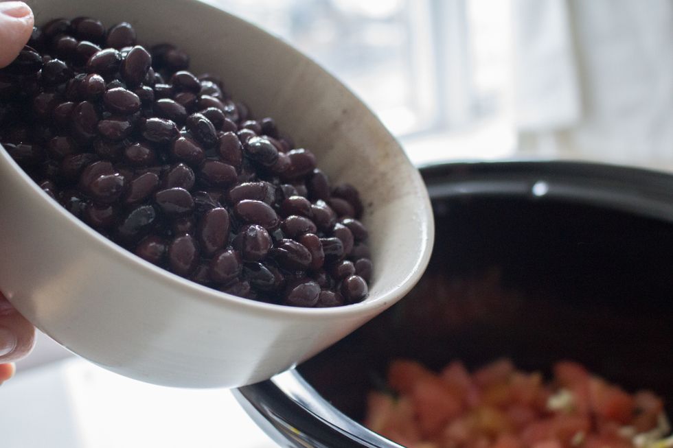 Add the black beans into the slow cooker.