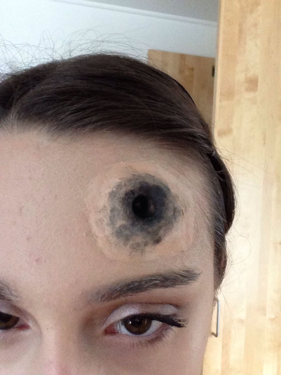 Add the black eyeshadow to create deepness