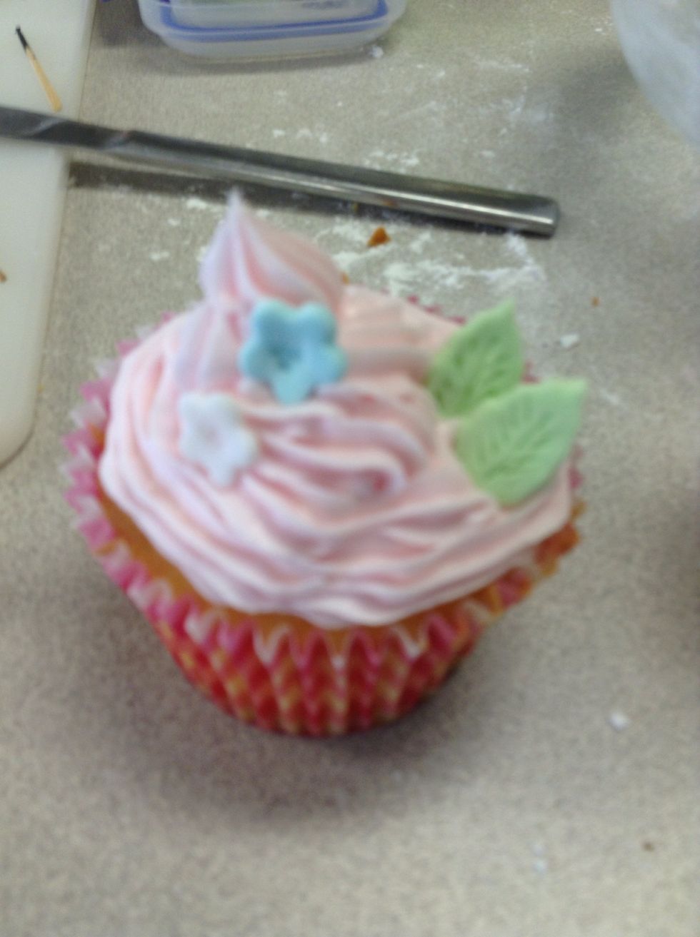 Add the blue and white flowers that you have previously made